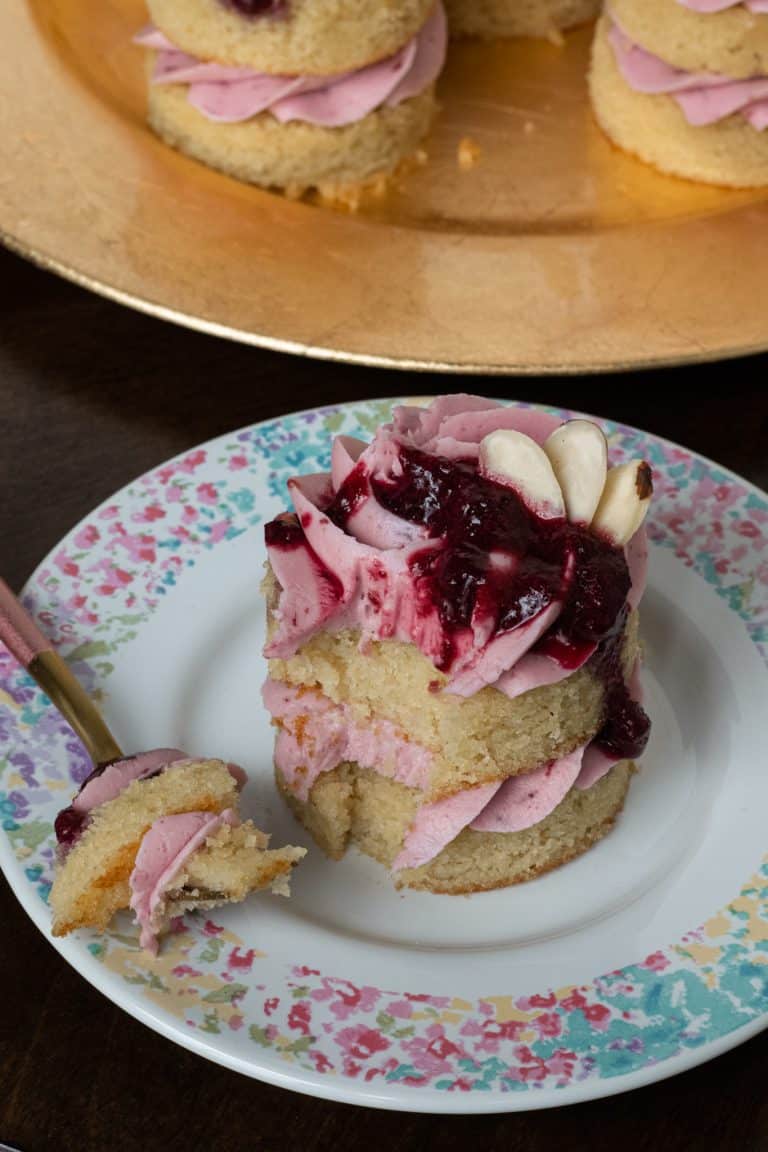 gluten free cherry almond little layer cake with a bite size piece cut out