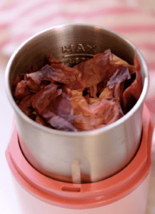 dried peach skins in a spice grinder