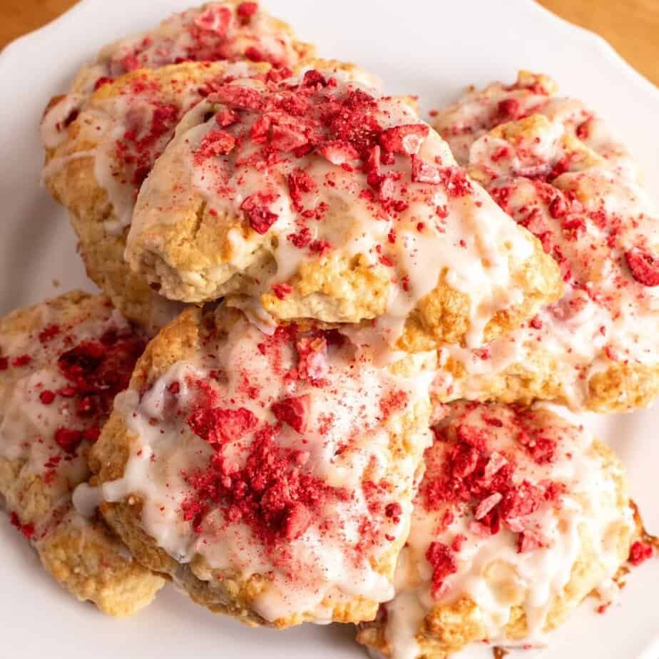 Buttery homemade strawberry shortcake cookies topped with sweet glaze and crushed strawberries, perfect for dessert or snack.