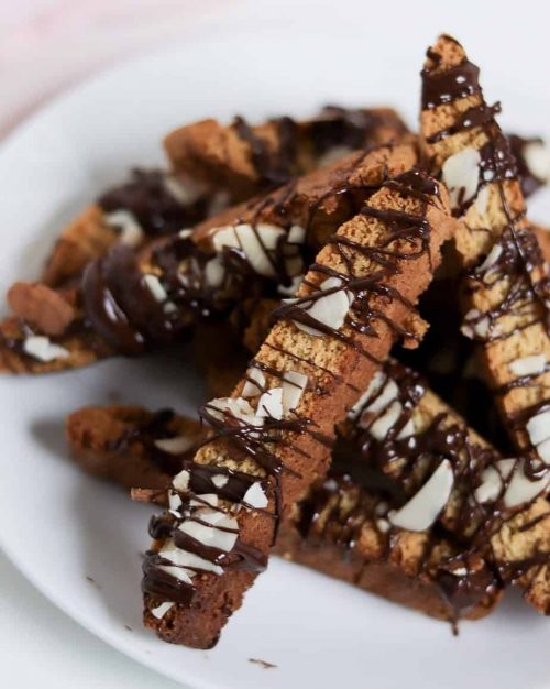 plated gluten free almond biscotti with chocolate drizzle