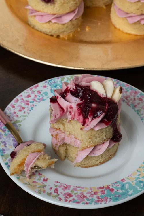 gluten free cherry almond little layer cake with a bite size piece cut out
